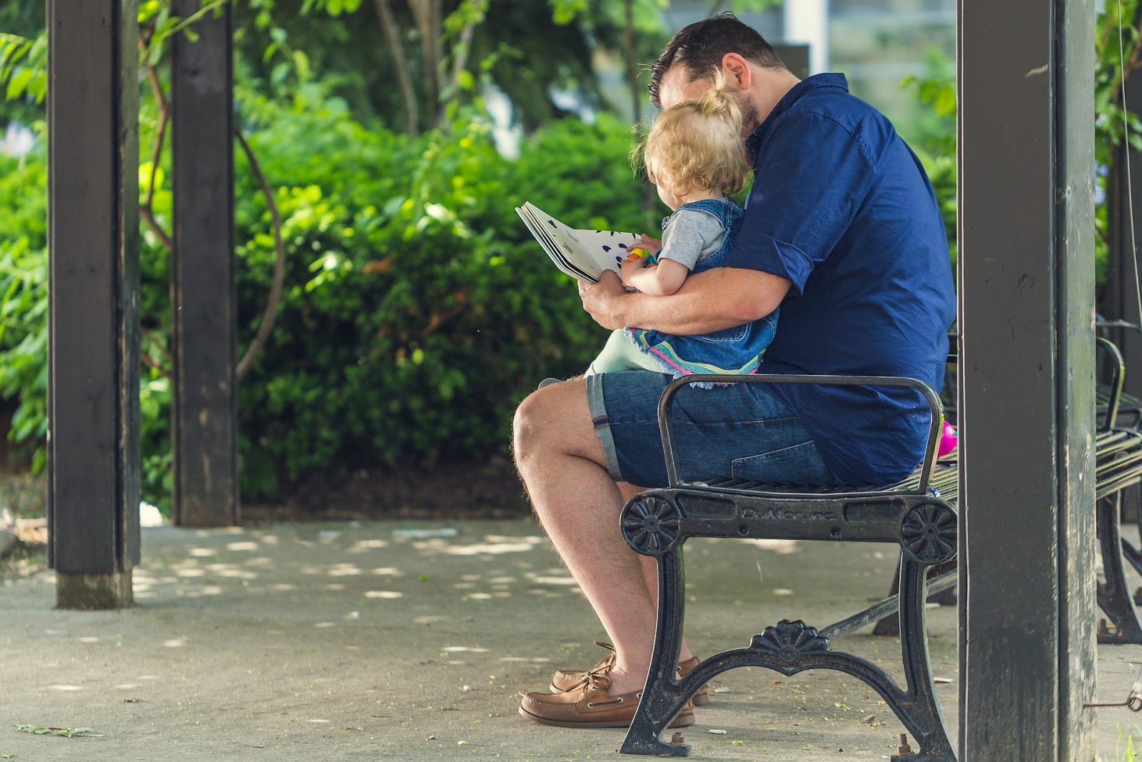 Dad reads to daughter